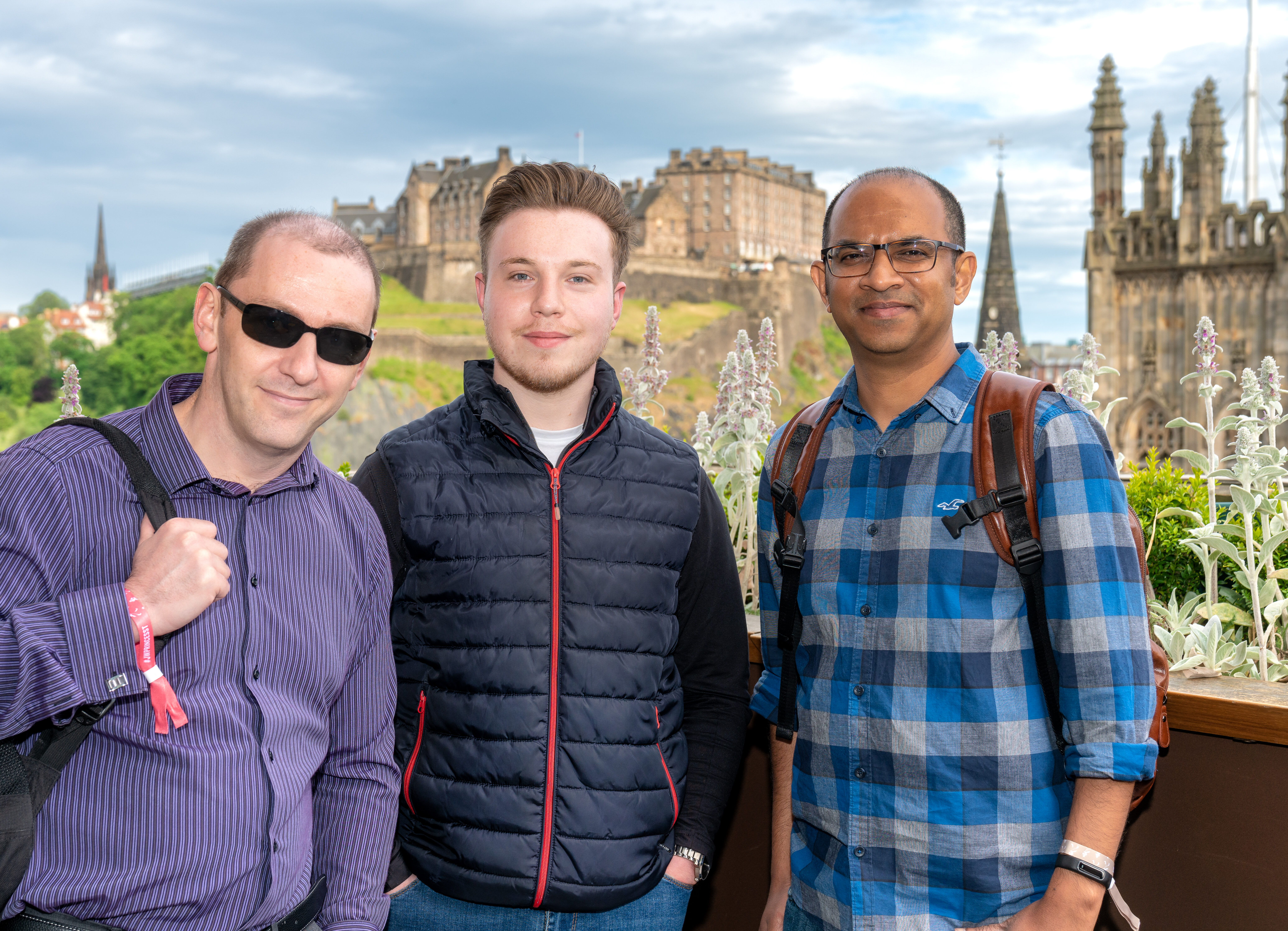 Optima Partners employees in front of Edinburgh castle